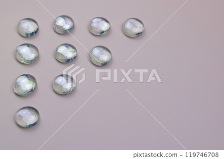 Glass drops on a colorful background with copy space, beautiful abstract texture with place for text Glass drops on a colorful background with copy space, beautiful abstract texture with place for text 119746708
