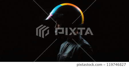 Conceptual depiction of a motorcyclist wearing a colored motorcycle helmet in a very dark and accentuated visual language - ai generated 119746827