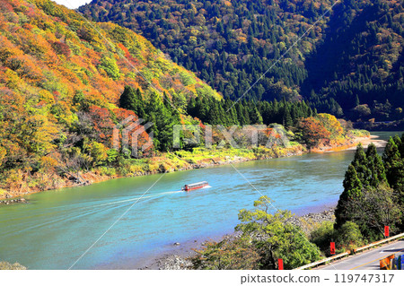 A boat ride down the Mogami River through the autumn leaves A boat ride down the Mogami River through the autumn leaves 119747317