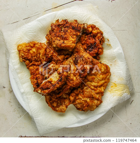 Fried beef chops close-up. Chopped beef meat in batter. Fried beef chops close-up. Chopped beef meat in batter. 119747464