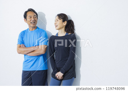 Middle-aged couple in sportswear Middle-aged couple in sportswear 119748096