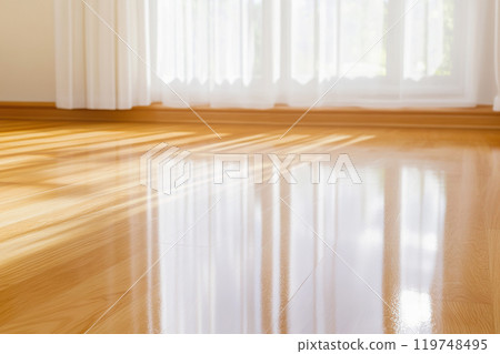 Sunlit Hardwood Floor with Bright Window Shadows in a Modern Interior. Sunlit Hardwood Floor with Bright Window Shadows in a Modern Interior. 119748495