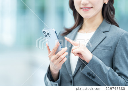 Business person operating a smartphone (parts model) 119748880