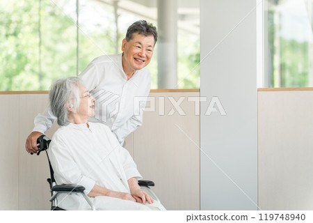 Elderly people in nursing homes and care facilities, senior couples and women in wheelchairs Elderly people in nursing homes and care facilities, senior couples and women in wheelchairs 119748940