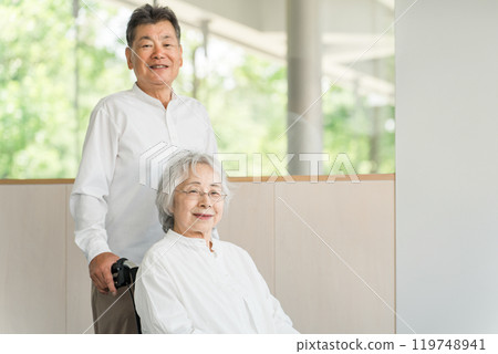 Elderly people in nursing homes and care facilities, senior couples and women in wheelchairs Elderly people in nursing homes and care facilities, senior couples and women in wheelchairs 119748941