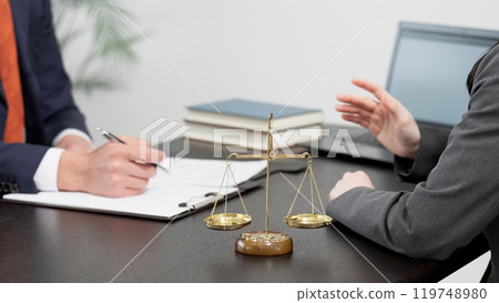 The hands of a lawyer receiving consultation on a problem 119748980