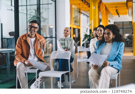 Smiling colleagues listening seminar in conference room 119749274