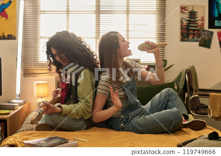 Enjoying Musical Jam Session in Cozy Bedroom Setting 119749666