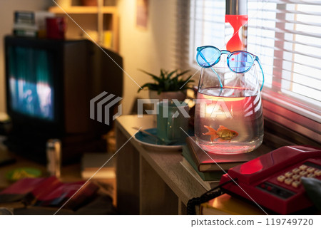 Fish Tank with Glasses on Pump and Books Nearby 119749720