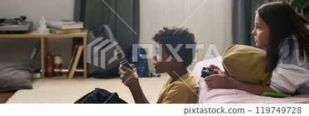 Children Enjoying Video Games in Living Room Children Enjoying Video Games in Living Room 119749728