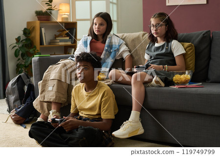 Children Engaging in Video Game Session Together Children Engaging in Video Game Session Together 119749799
