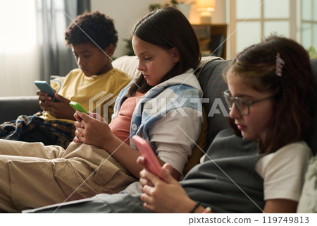 Children Engaging with Smartphones in Casual Setting Children Engaging with Smartphones in Casual Setting 119749813