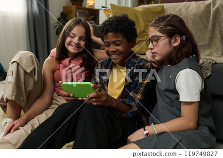 Friends Enjoying Time Together with Technology Gadgets 119749827