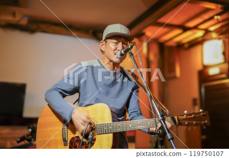 Man enjoying live music 119750107