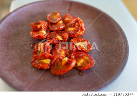 Homemade semi-dried tomatoes 119750374