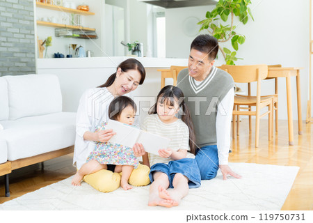 Senior couple relaxing in the living room and grandchildren 119750731