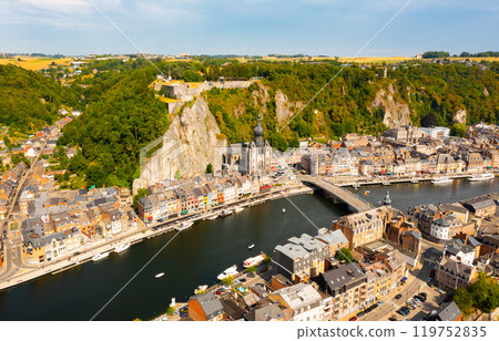Summer view of Dinant cityscape on banks of river Meuse, Belgium 119752835