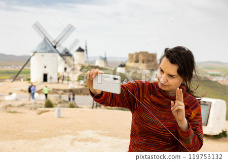 Female tourist taking selfies in Consuerga, Province of Toledo, Spain 119753132