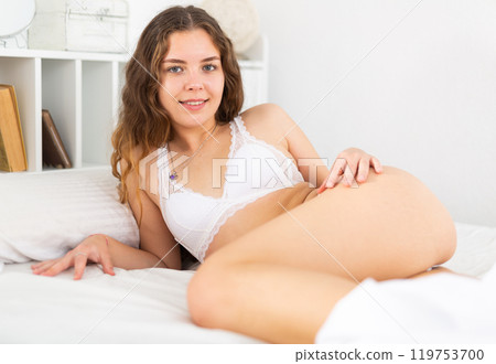 Attractive girl in white underwear posing Attractive girl in white underwear posing 119753700