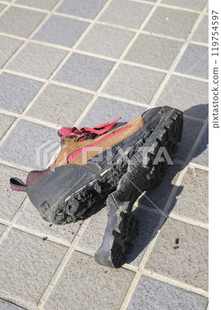 Hiking shoes with torn soles Hiking shoes with torn soles 119754597