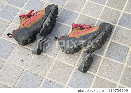 Hiking shoes with torn soles Hiking shoes with torn soles 119754599