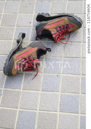 Hiking shoes with torn soles Hiking shoes with torn soles 119754604