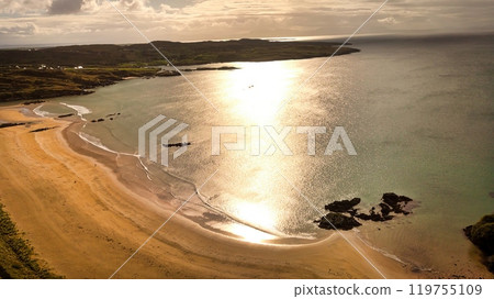 Fintra Bay in Donegal Ireland - Peaceful and Serene Beach Scene Featuring Rolling Hills and Fintra Bay in Donegal Ireland - Peaceful and Serene Beach Scene Featuring Rolling Hills and 119755109