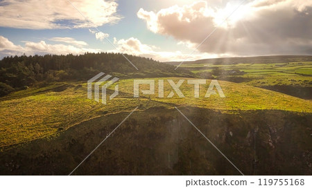 A Serene Landscape Showcasing Beautiful Rolling Hills ad Bright, Clear Skies High Above Us A Serene Landscape Showcasing Beautiful Rolling Hills ad Bright, Clear Skies High Above Us 119755168