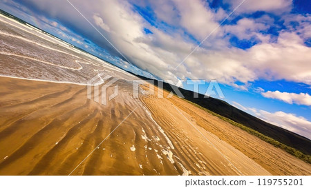 Low High speed FPV Flight over a beach at the west coast of Ireland - A calm and serene beach scene Low High speed FPV Flight over a beach at the west coast of Ireland - A calm and serene beach scene 119755201