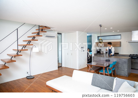 Young Japanese couple with man cooking 119756603