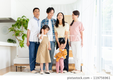 Three-generation family relaxing in the living room Three-generation family relaxing in the living room 119756961