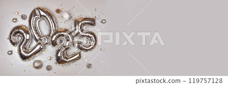 2025 Silver Balloon Numbers with Holiday Decorations. Festive New Year Celebration Theme with Metallic Ornaments and Star Confetti 2025 Silver Balloon Numbers with Holiday Decorations. Festive New Year Celebration Theme with Metallic Ornaments and Star Confetti 119757128