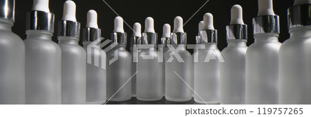 Large number of empty bottles with pipettes stand in circle Large number of empty bottles with pipettes stand in circle 119757265