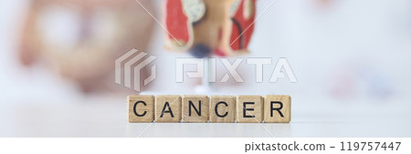 Word Cancer constructed of wooden cubes against rectum Word Cancer constructed of wooden cubes against rectum 119757447
