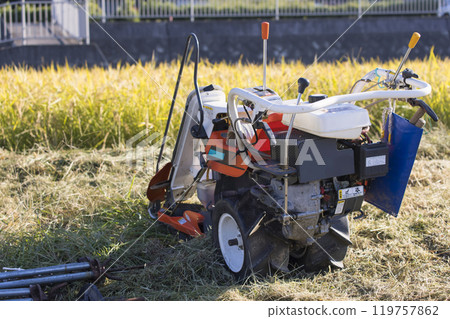 Image of rice harvesting: rice field and binder Image of rice harvesting: rice field and binder 119757862
