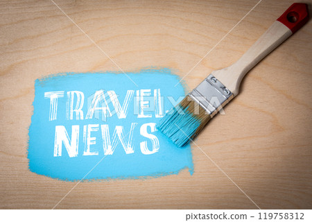 Travel News. Blue paint and paint brush on wooden texture background Travel News. Blue paint and paint brush on wooden texture background 119758312