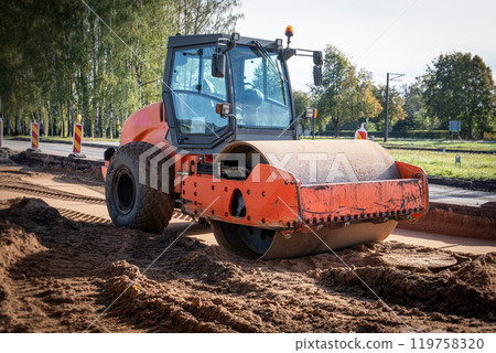Road roller at construction site. Heavy machinery 119758320