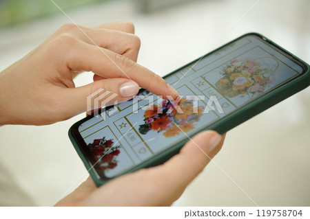 Browsing Floral Arrangements on Smartphone Browsing Floral Arrangements on Smartphone 119758704
