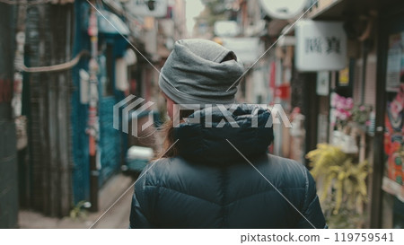 Young woman exploring tokyo's charming streets, immersing in local culture and vibrant atmosphere. Discovering traditional buildings, quaint shops, and authentic japanese life Young woman exploring tokyo's charming streets, immersing in local culture and vibrant atmosphere. Discovering traditional buildings, quaint shops, and authentic japanese life 119759541