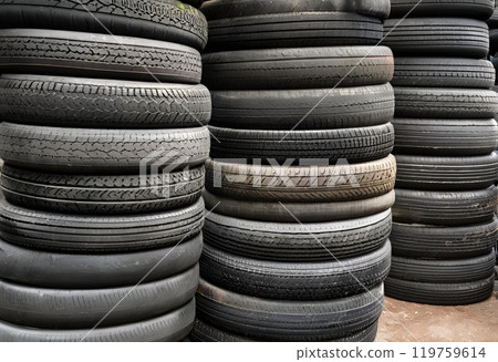 Old tires stacked, awaiting destruction or recycling for reuse.AI Generated Old tires stacked, awaiting destruction or recycling for reuse.AI Generated 119759614