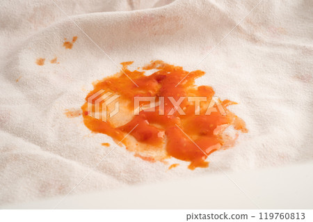 Dirty tomato sauce stain or ketchup on cloth to wash with washing powder, cleaning housework. Dirty tomato sauce stain or ketchup on cloth to wash with washing powder, cleaning housework. 119760813