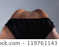 Photo of the woman belly and navel during doing a backbend 119761143