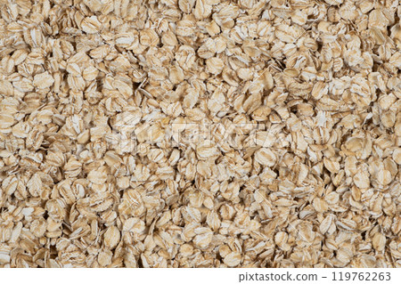 Background of uncooked raw oatmeal top view 119762263