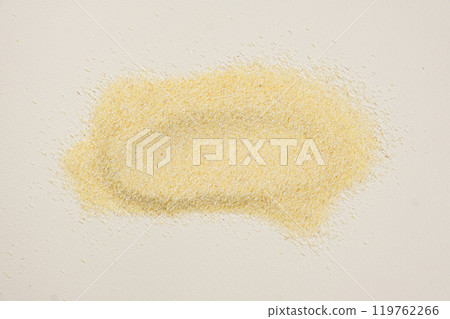 Smear of uncooked raw durum wheat semolina top view. Smear of uncooked raw durum wheat semolina top view. 119762266