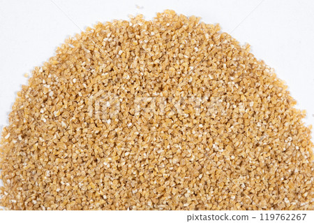 Wheat Cereal Texture Close-up Top View on White Background. Wheat Cereal Texture Close-up Top View on White Background. 119762267