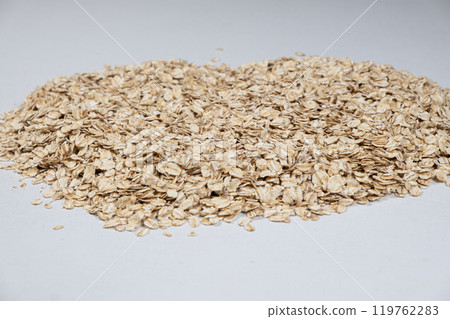 Uncooked raw oatmeal cereal close-up. Uncooked raw oatmeal cereal close-up. 119762283