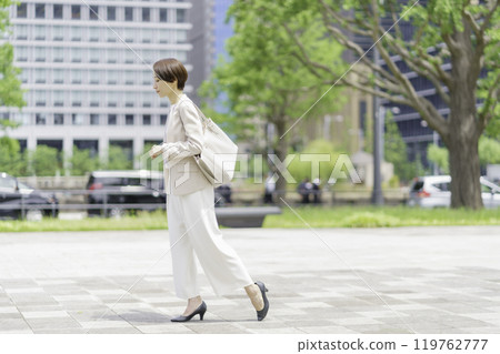 businesswoman walking in office 119762777