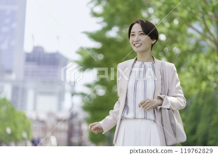 Portrait of a businesswoman walking through an office district 119762829