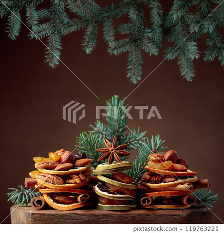 Christmas still-life with dried fruits and nuts. Christmas still-life with dried fruits and nuts. 119763221