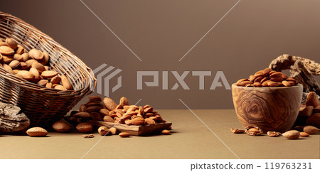 Almond nuts on a brown background. 119763231